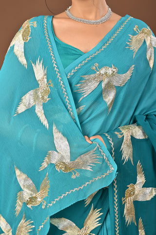 Shaded Teal Green Platinum Chiffon Saree with Aari Kasab Ganga Jamuni Bird Motif border with zardozi and sequins