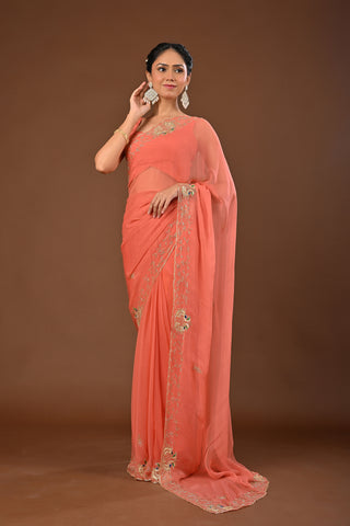 Dusty Peach Chiffon Saree with Cutting Cutdana border with Peacock Motifs
