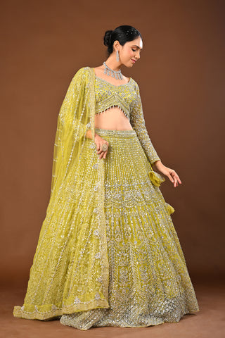 Designer Lemon Green Soft Net Lehenga adorned with Mirror