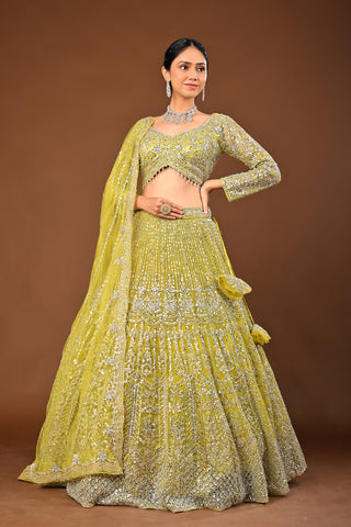 Designer Lemon Green Soft Net Lehenga adorned with Mirror