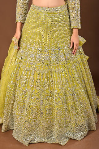 Designer Lemon Green Soft Net Lehenga adorned with Mirror