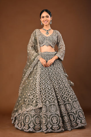 Designer Mehandi green Soft Net Lehenga adorned with Kundan and Stone