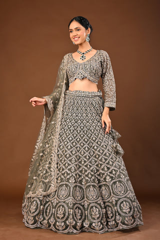 Designer Mehandi green Soft Net Lehenga adorned with Kundan and Stone