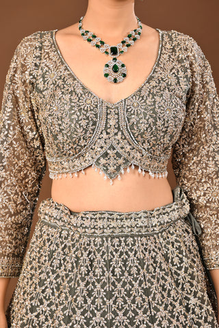 Designer Mehandi green Soft Net Lehenga adorned with Kundan and Stone
