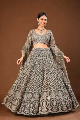 Designer Mehandi green Soft Net Lehenga adorned with Kundan and Stone